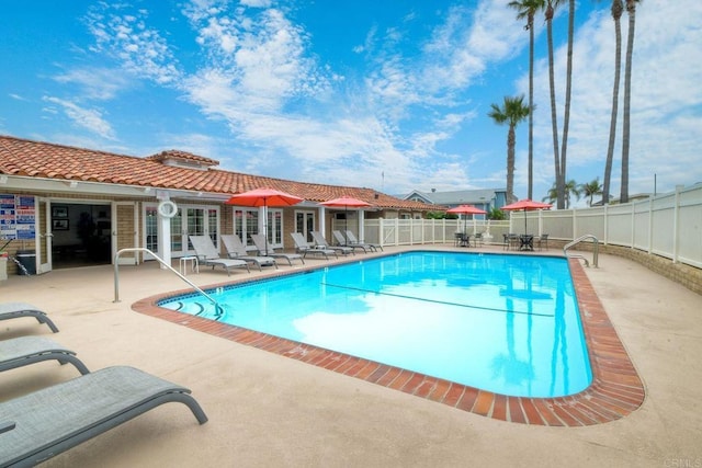 view of swimming pool with a patio area