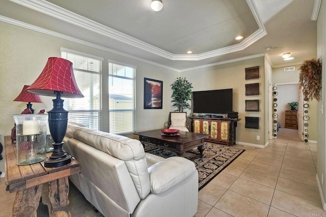 living room with a raised ceiling, ornamental molding, and light tile patterned floors