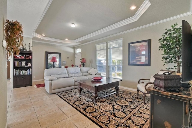 tiled living room with crown molding and a tray ceiling