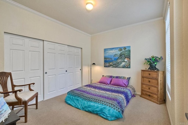 carpeted bedroom with crown molding and a closet