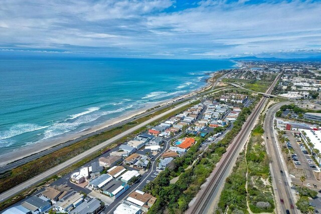 aerial view featuring a beach view and a water view