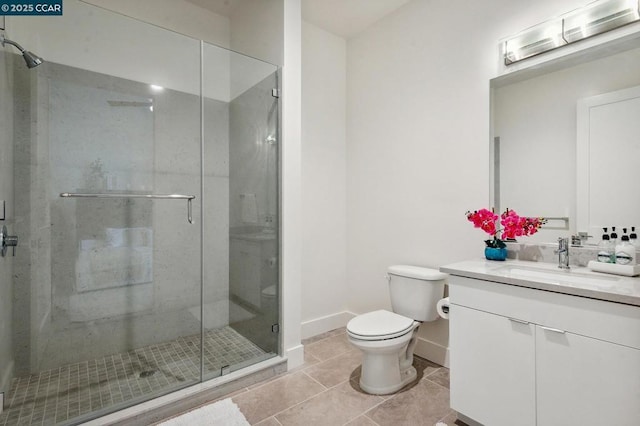 bathroom featuring toilet, vanity, tile patterned flooring, and a shower with door