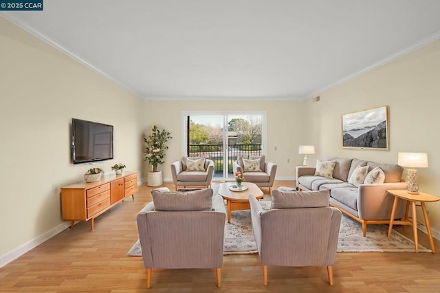 living room featuring ornamental molding and light hardwood / wood-style floors