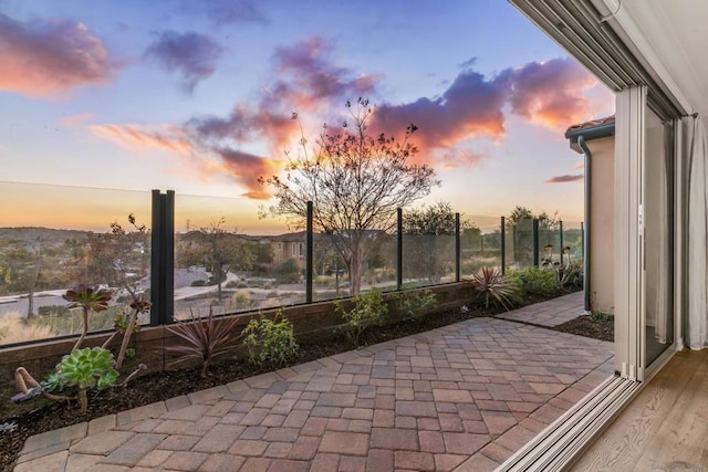 view of patio terrace at dusk