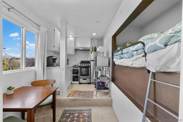 kitchen featuring appliances with stainless steel finishes and white cabinetry