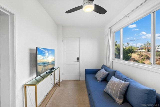 living area featuring ceiling fan