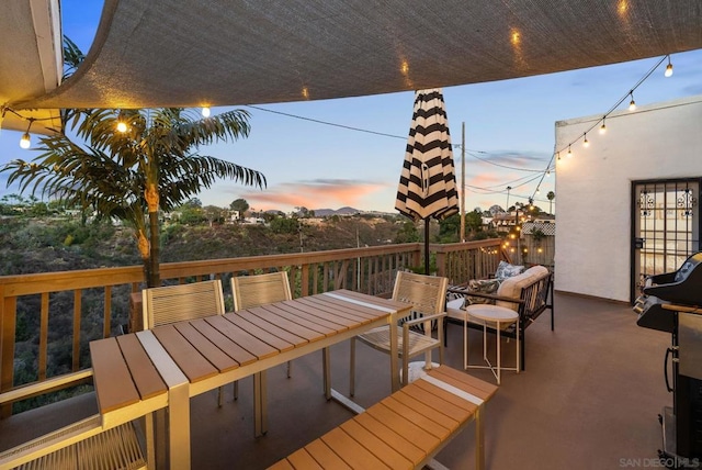 deck at dusk with outdoor lounge area