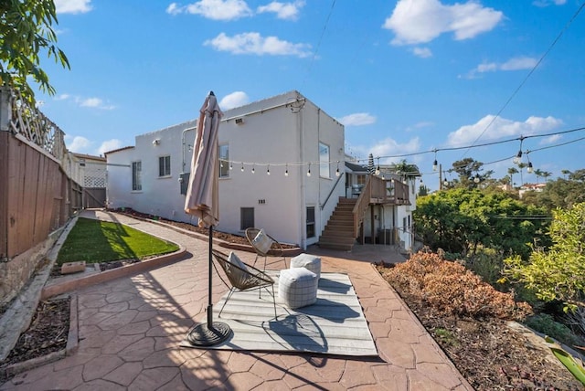 rear view of property featuring a patio area