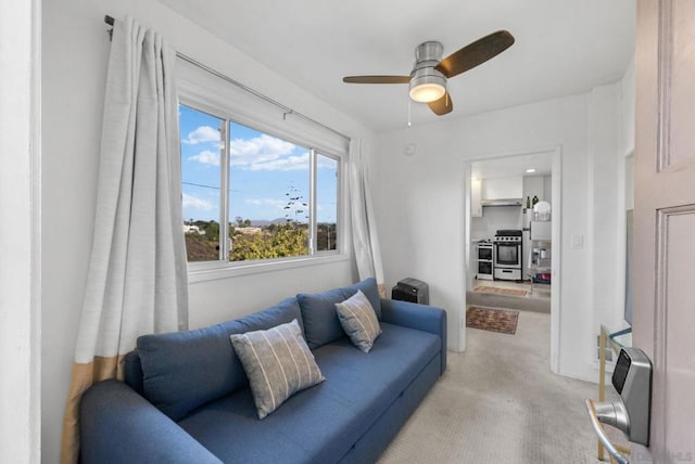 living room with ceiling fan and heating unit