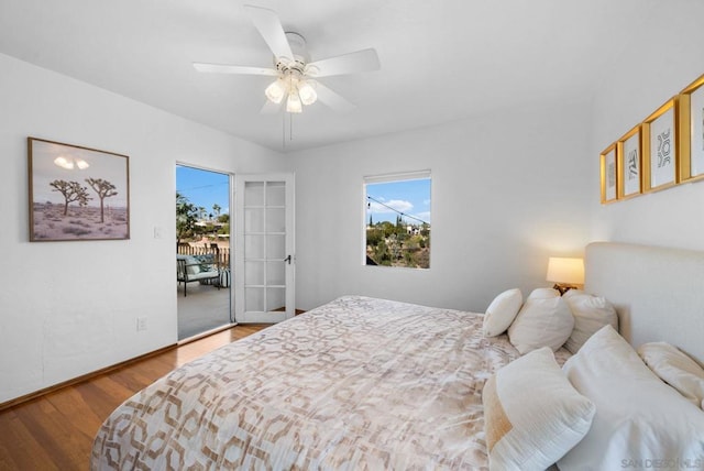 bedroom with ceiling fan, french doors, and hardwood / wood-style floors