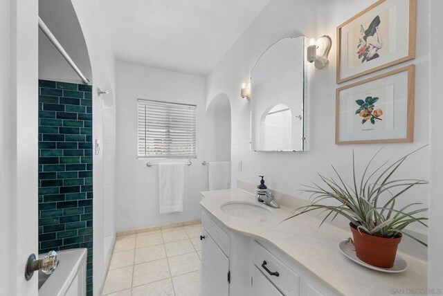 bathroom with vanity, shower / washtub combination, and tile patterned flooring