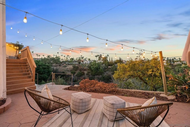 view of patio terrace at dusk