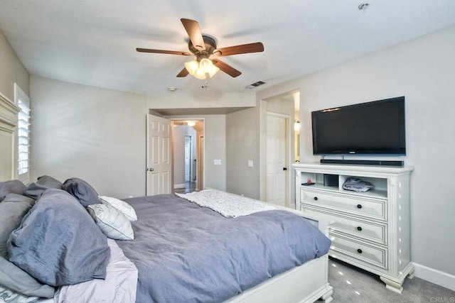 bedroom with ceiling fan and carpet