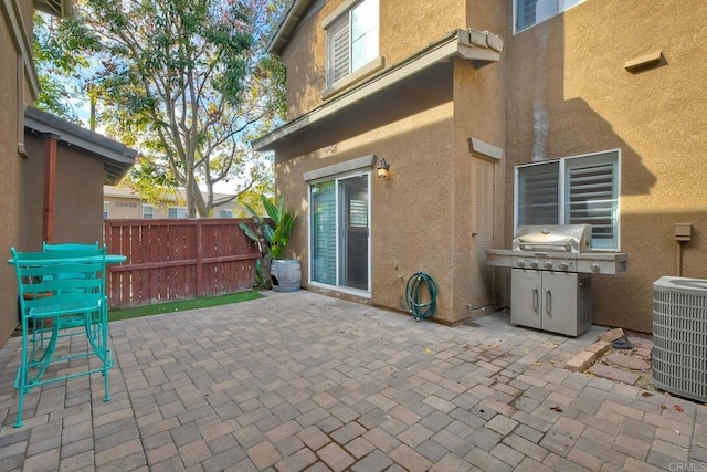 view of patio / terrace with grilling area and central air condition unit