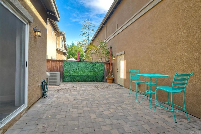 view of patio / terrace with central AC unit