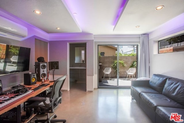 office area featuring concrete floors and a wall unit AC