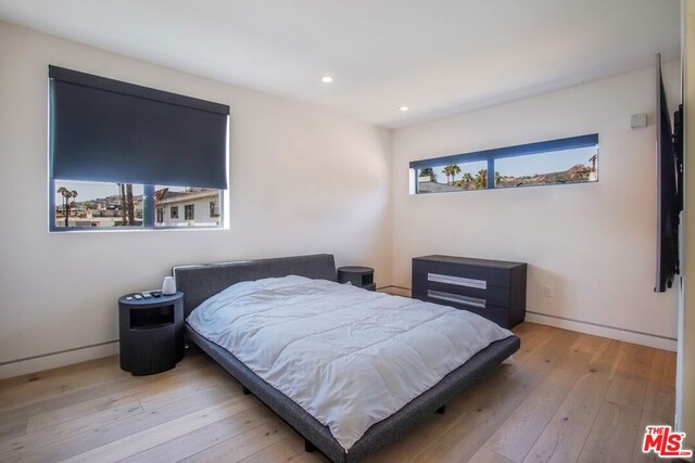 bedroom featuring light wood-type flooring