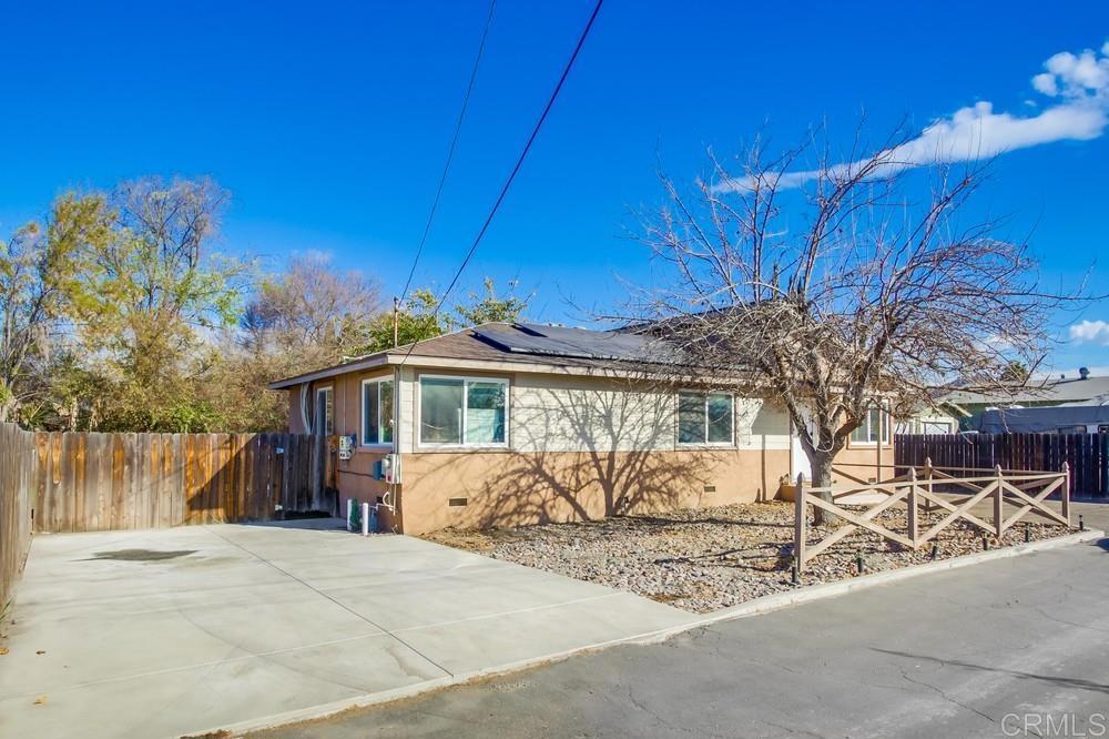 view of front of property with solar panels