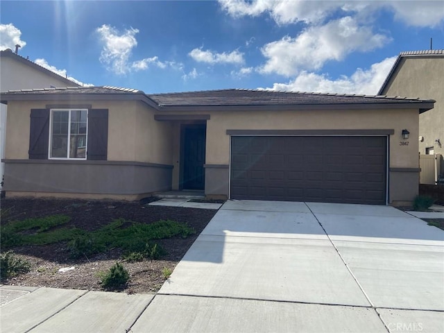 single story home featuring a garage