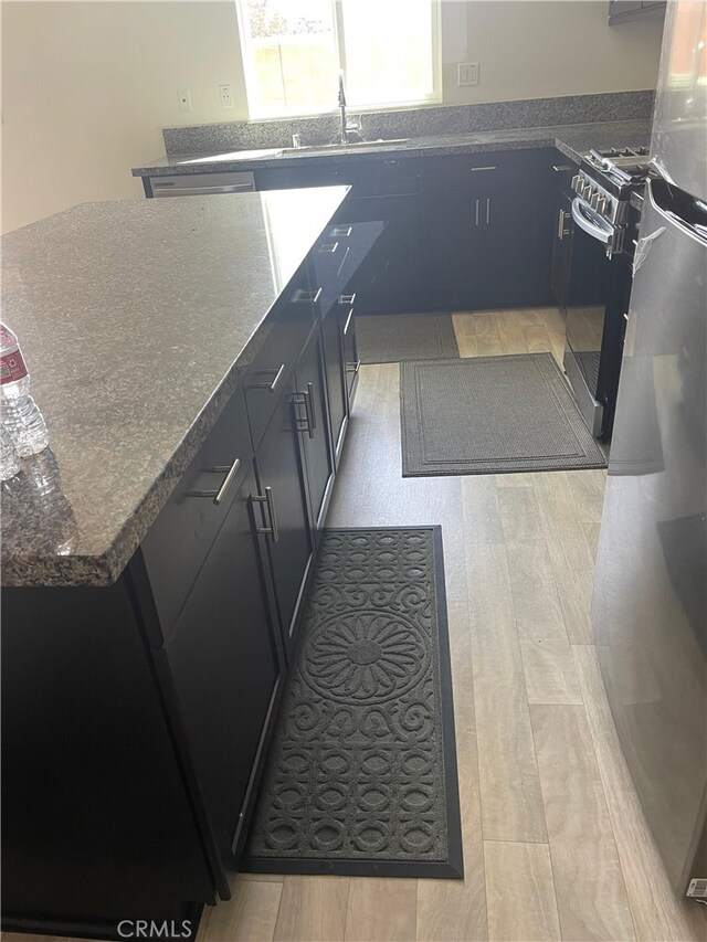 kitchen with stainless steel range oven and sink