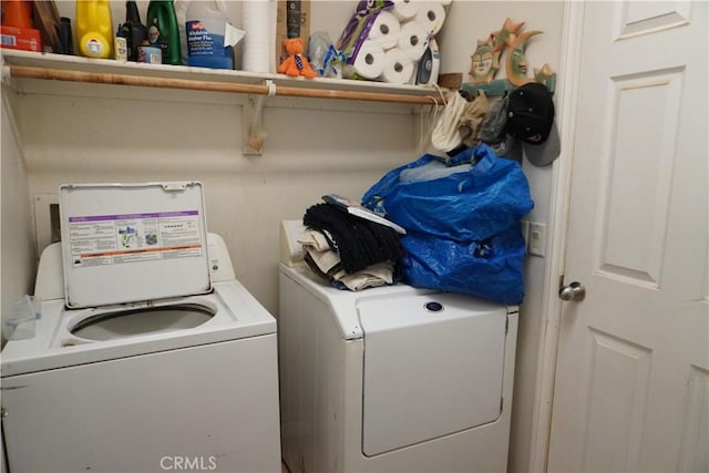 laundry area with washing machine and dryer