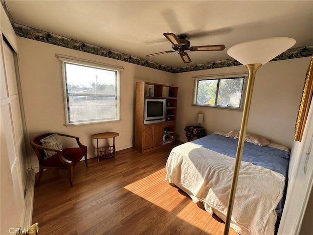 bedroom featuring ceiling fan and wood-type flooring