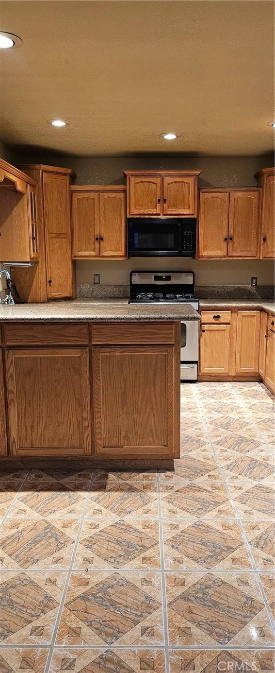 kitchen with white gas stove