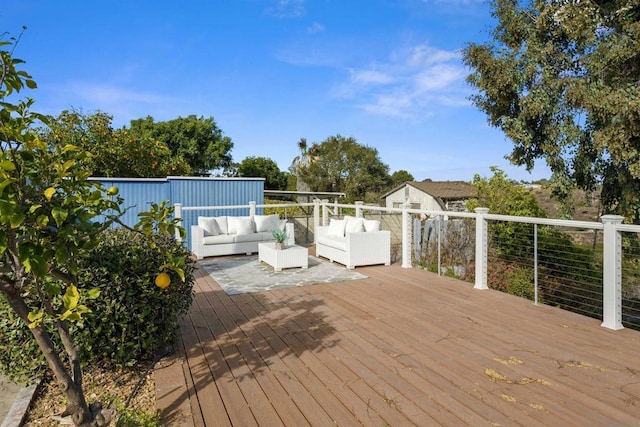 wooden deck featuring outdoor lounge area