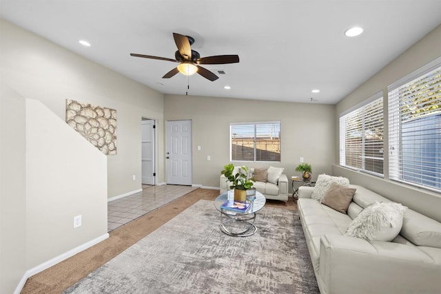 living room featuring light tile patterned flooring and ceiling fan