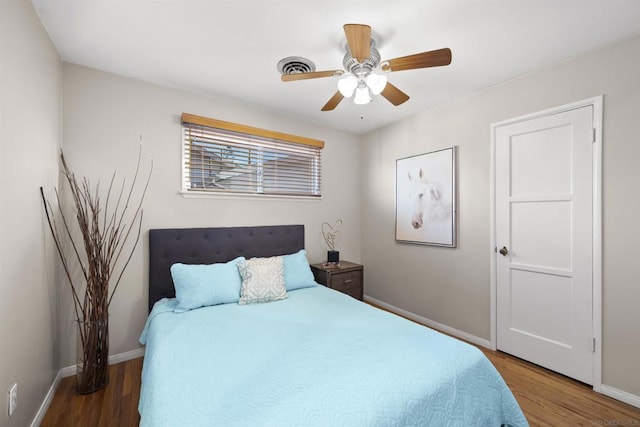 bedroom featuring hardwood / wood-style floors and ceiling fan