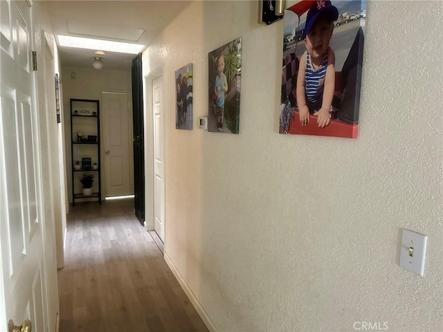 hall featuring wood-type flooring