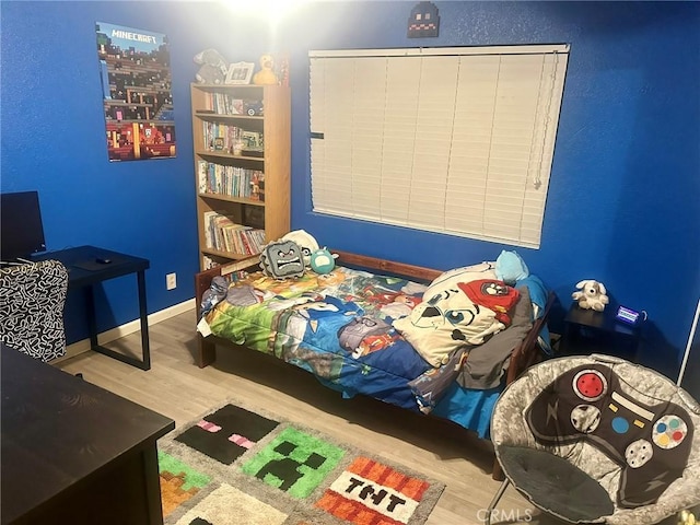 bedroom featuring light wood-type flooring