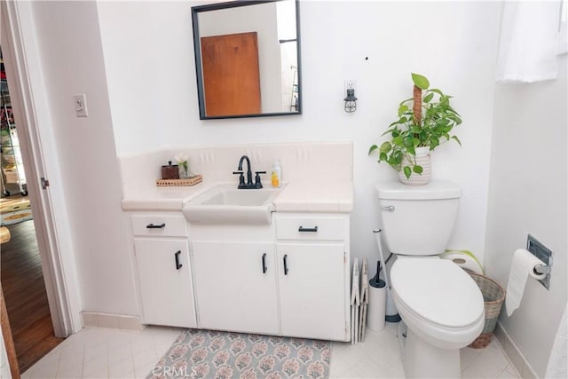 bathroom featuring toilet and vanity