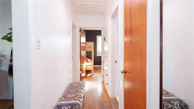 hall with light hardwood / wood-style flooring