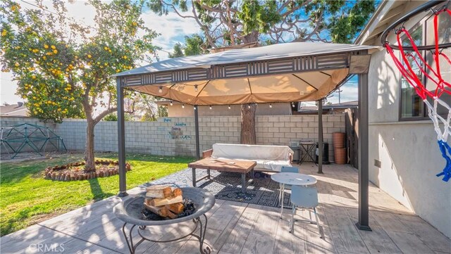 view of patio / terrace featuring an outdoor living space with a fire pit and a gazebo