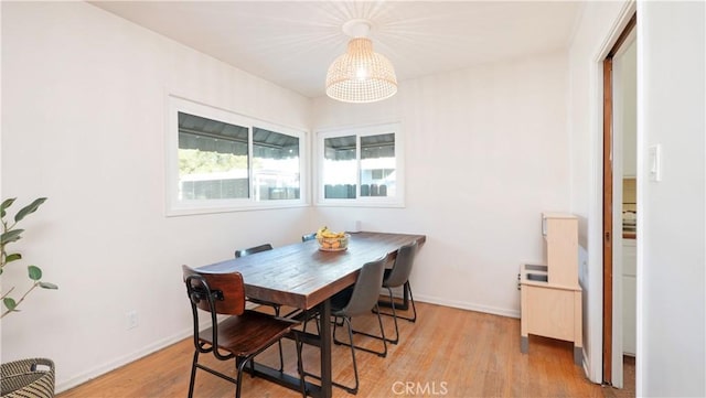 dining space with light wood-type flooring