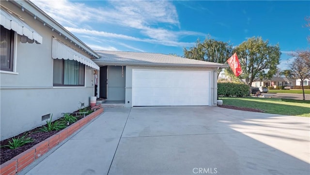 garage featuring a lawn