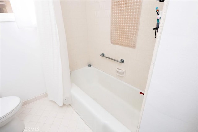 bathroom with toilet and shower / bathtub combination with curtain