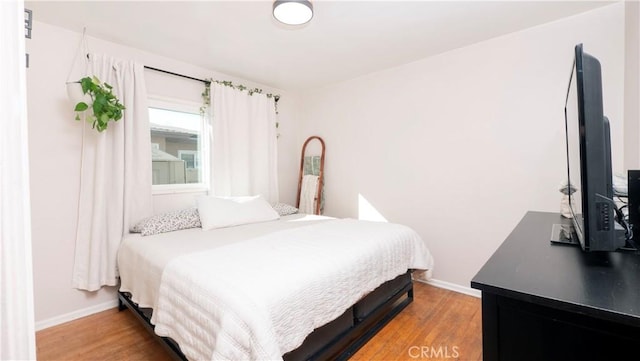 bedroom featuring hardwood / wood-style floors