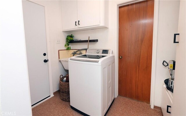 washroom featuring cabinets, washer / clothes dryer, and sink