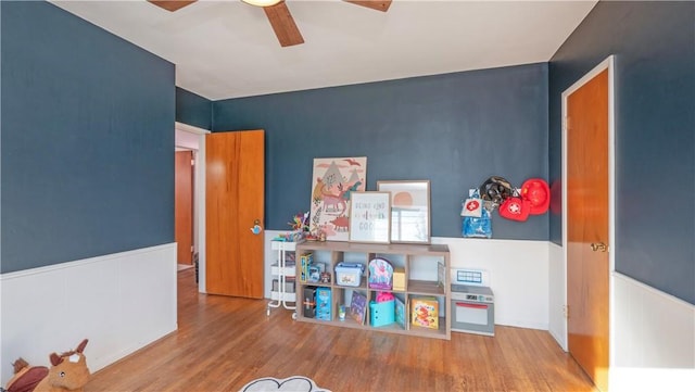 playroom featuring ceiling fan and hardwood / wood-style floors