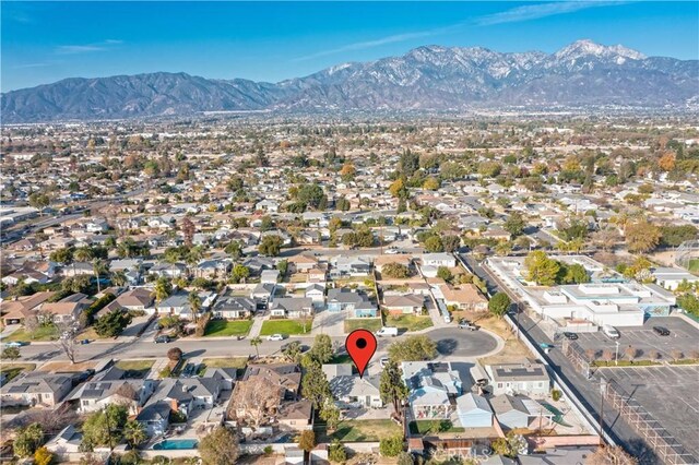 birds eye view of property with a mountain view