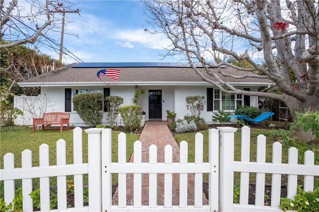 ranch-style home featuring a front lawn