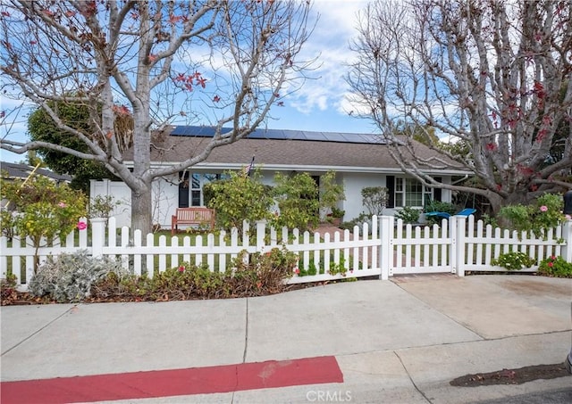 ranch-style house with solar panels