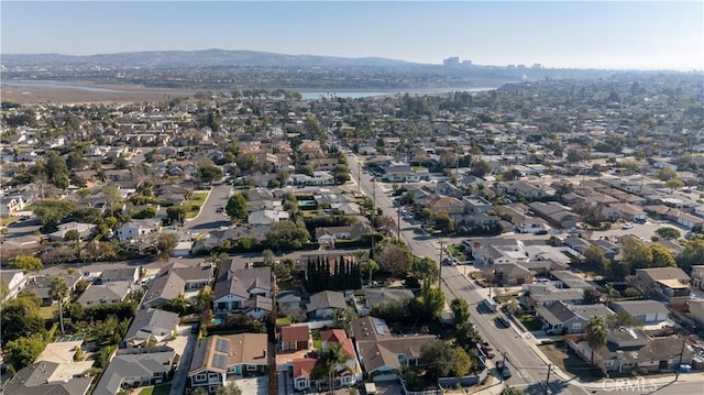 birds eye view of property featuring a water and mountain view