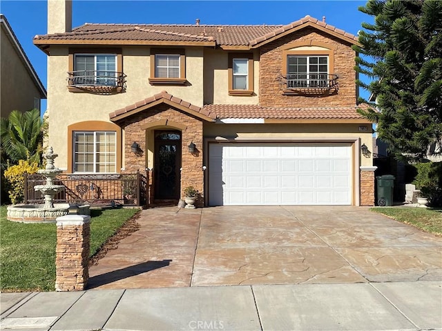 mediterranean / spanish home featuring a garage