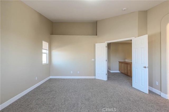 unfurnished bedroom featuring light colored carpet