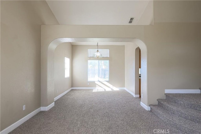 unfurnished room featuring carpet