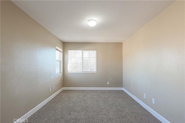 unfurnished room with carpet floors