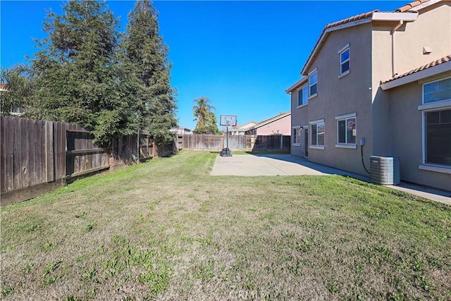 view of yard with cooling unit and a patio area